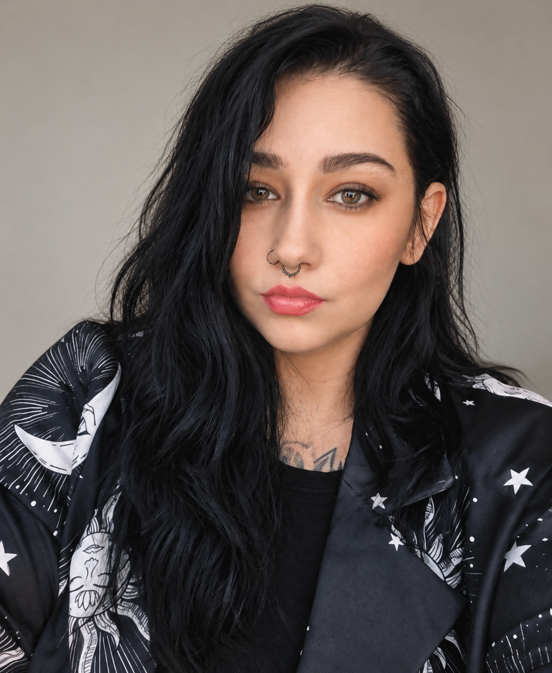 Portrait of Shea Ni wearing a black celestial-print jacket